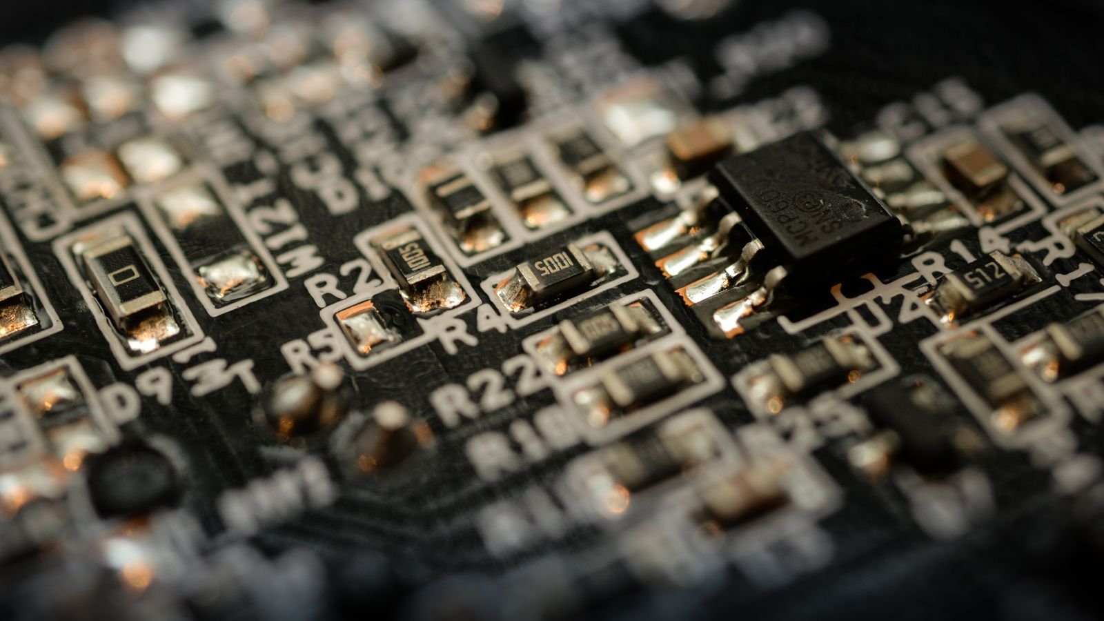 Detailed close-up of a microchip on an electronic circuit board, representing quantum computing hardware crossing key error-rate thresholds