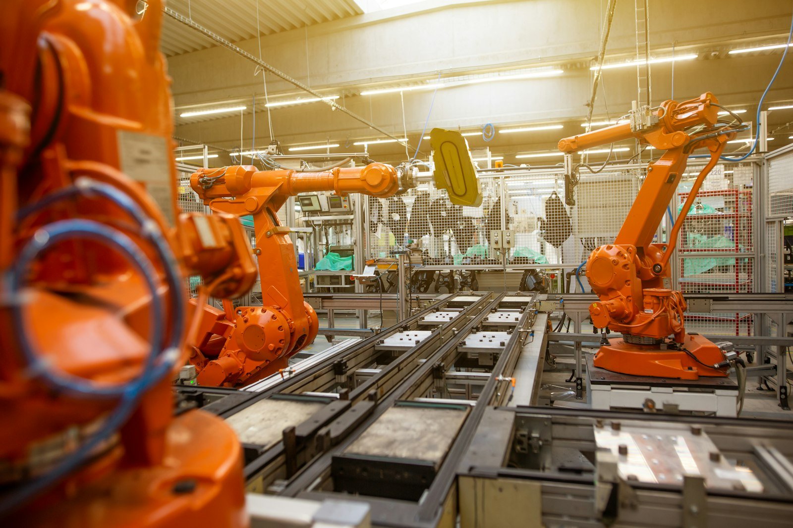 Factory floor filled with orange automated robotic machines