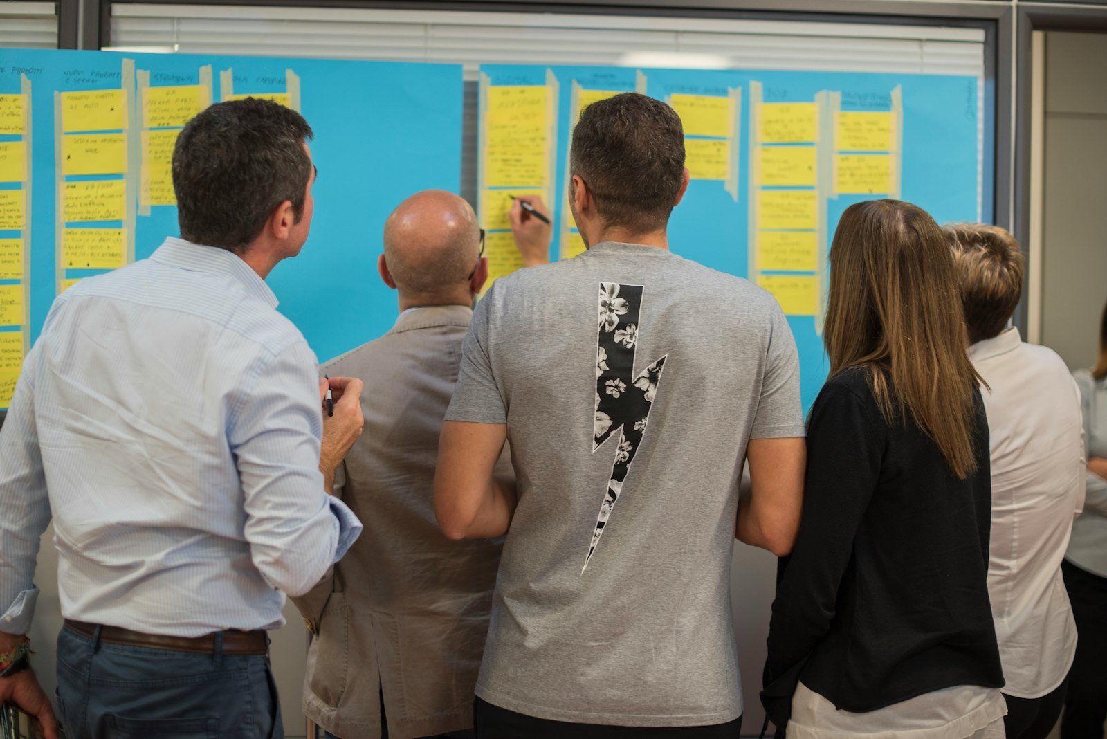 Team members collaborating in an innovation idea generation workshop