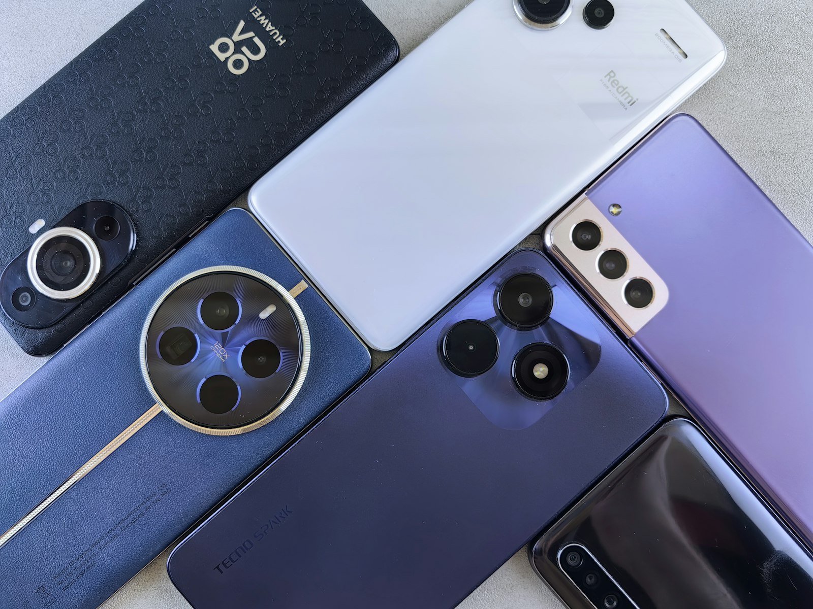 Several smartphones with camera modules placed next to each other